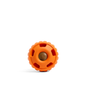 Orange round dog toy with textured ring, holes, and a center ball