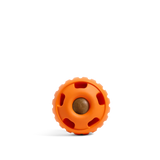 Orange round dog toy with textured ring, holes, and a center ball